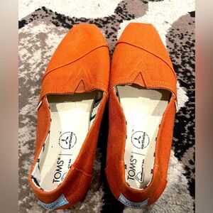 TOMS Vibrant Orange Slip-Ons